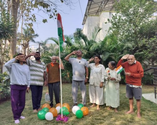 Elderly Residents Celebrating With Indian Flag In Care Home Garden